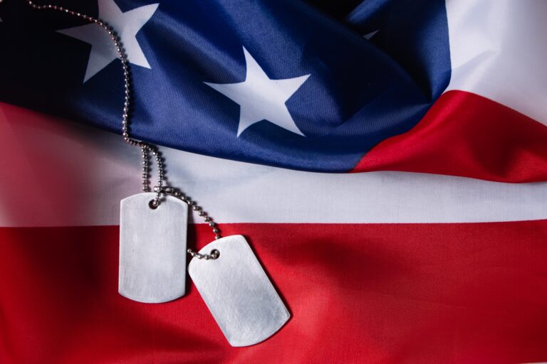 Memorial day concept. American flag and military dog tags on a black background. Remember and honor.